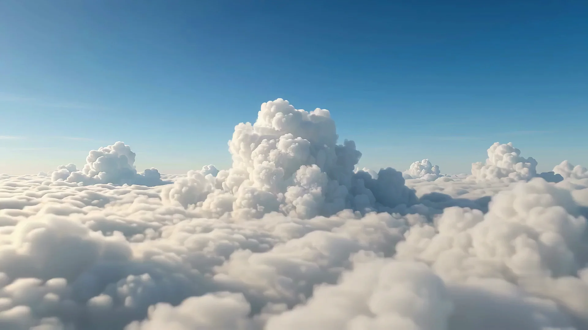 Blick über ein Wolkenmeer unter blauem Himmel